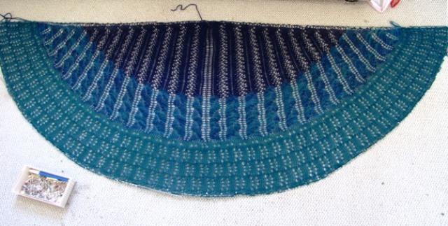 Shawl being blocked on wires